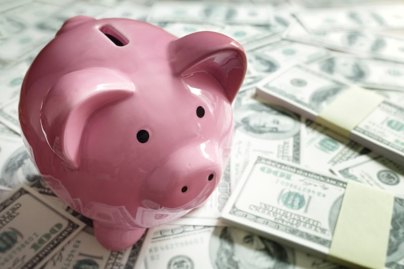 Federal HVAC Rebates Now Available! Piggy bank on money concept for business finance, investment, saving or retirement fund.